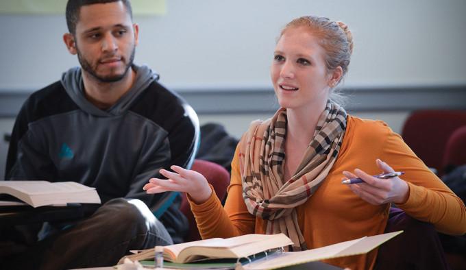 Image of students discussing. 